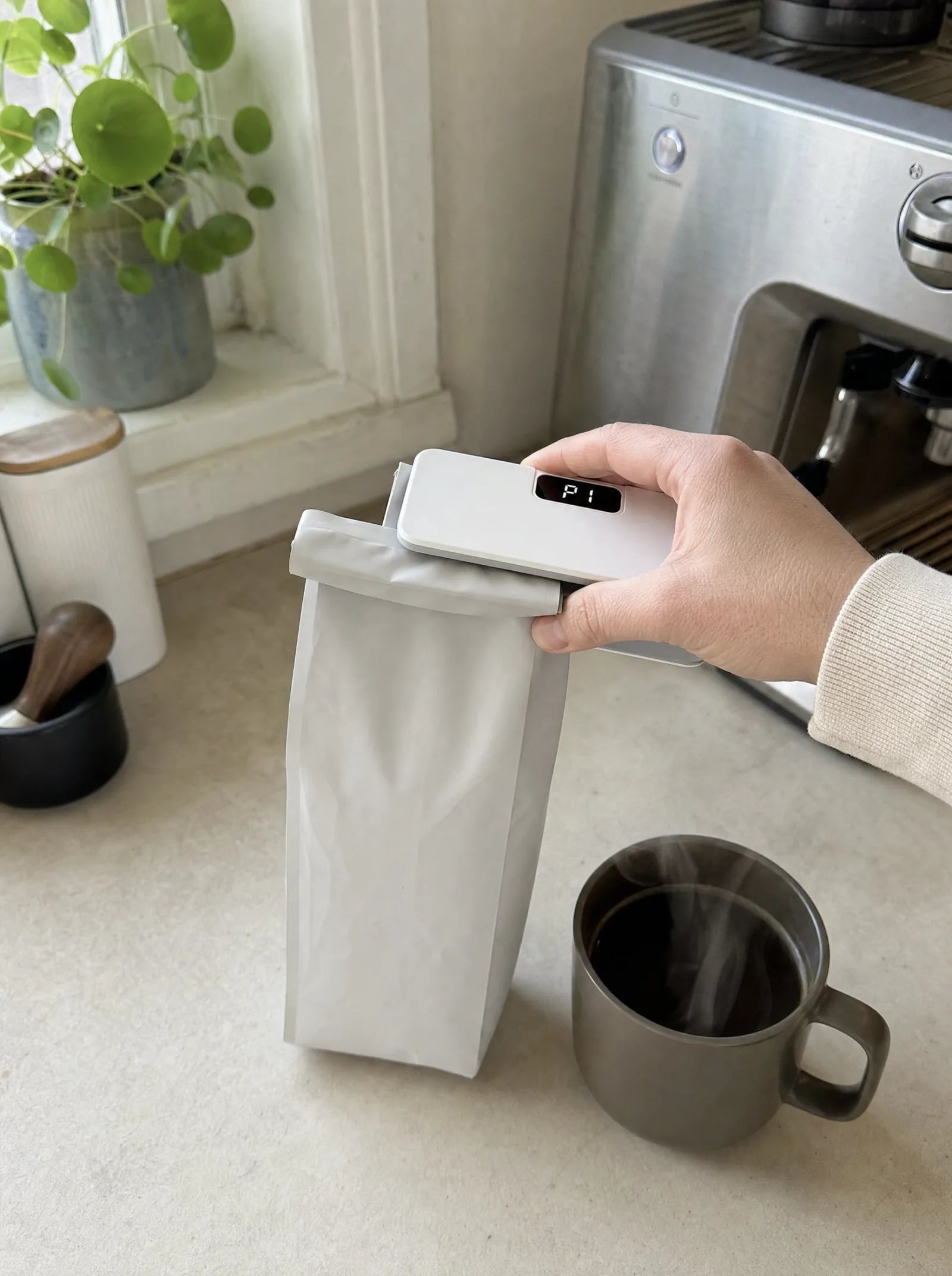 Resealing a coffee bag with SealMate