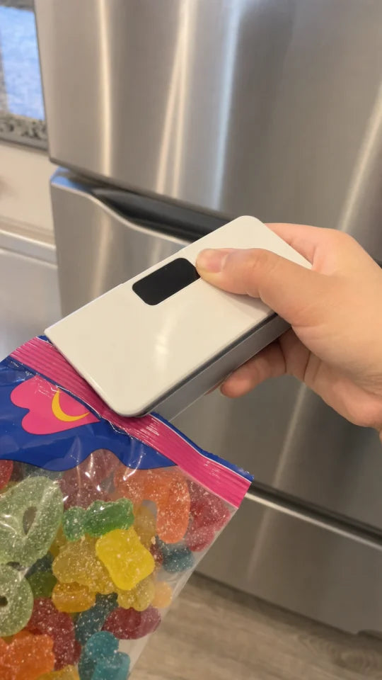 Customer sealing a snack bag with SealMate