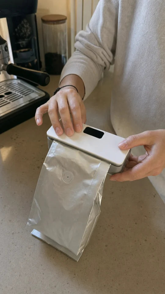 Customer sealing a snack bag with SealMate