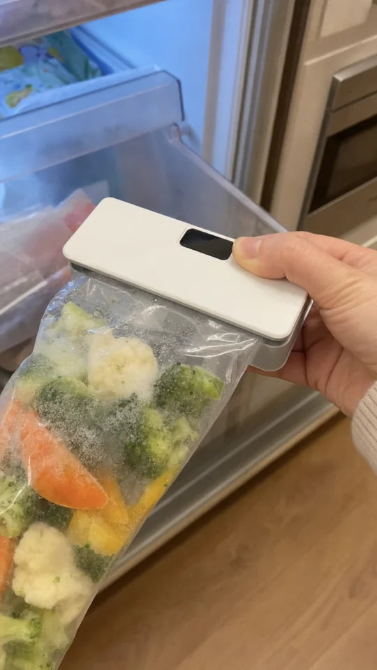 Customer sealing a snack bag with SealMate